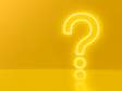 a neon question mark on a yellow background